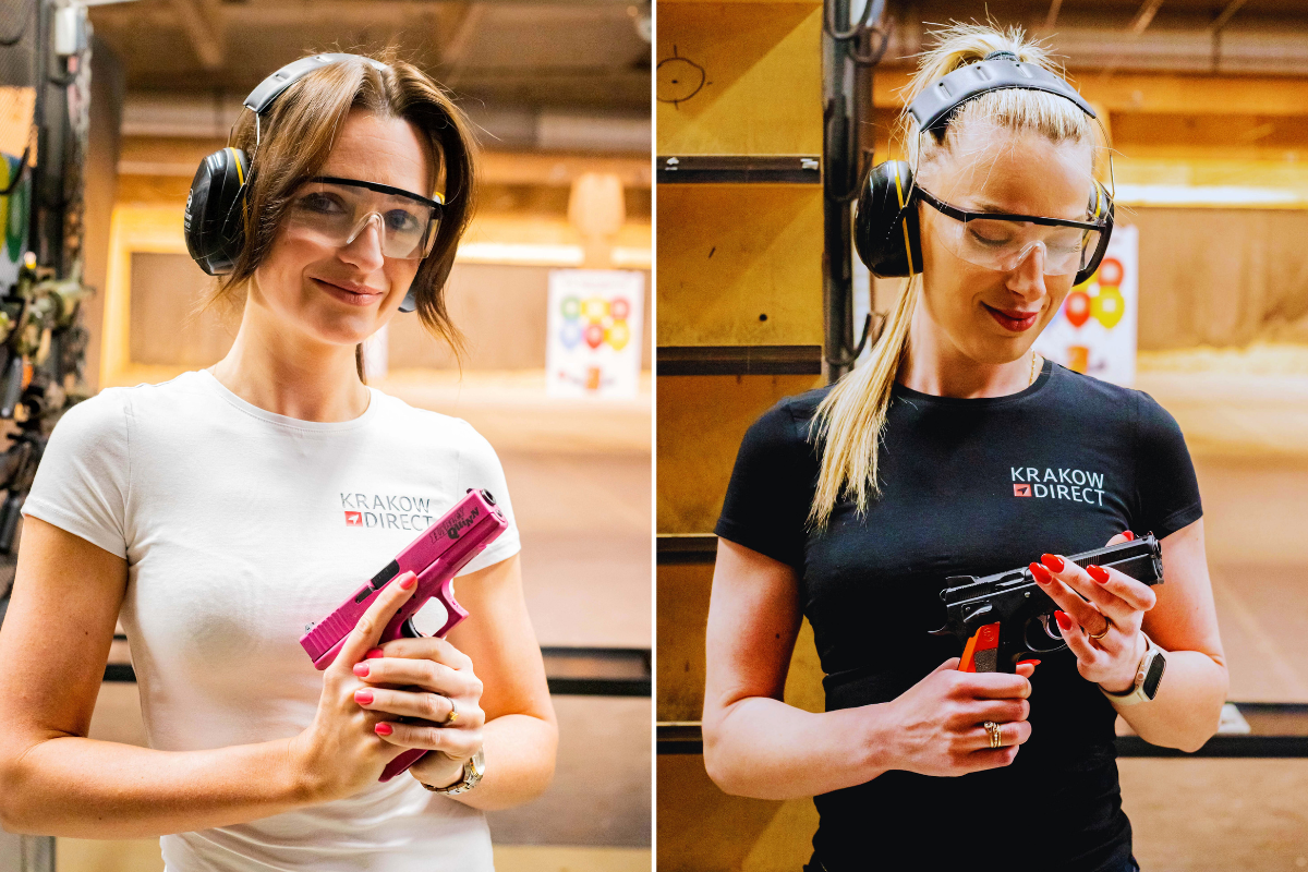 Two women at a Krakow shooting range holding handguns and wearing protective gear before target practice.