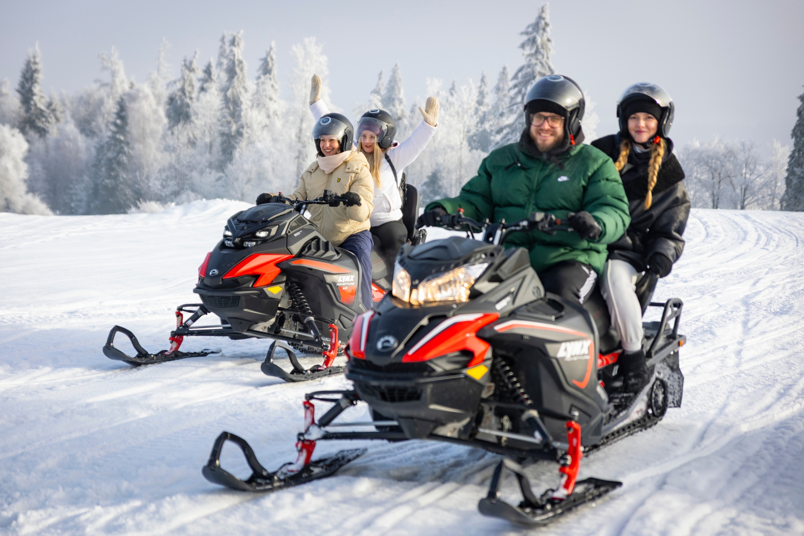 zakopane-snowmobile-tour-group Group riding snowmobiles on a Zakopane Snowmobile Tour in winter